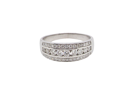 A lovely 18 carat white gold half hoop ring. Set with a middle row of nine bright white brilliant cut diamonds, graduate from 2.2mm to 2.6mm. The top and bottom rows are also set with small diamonds.