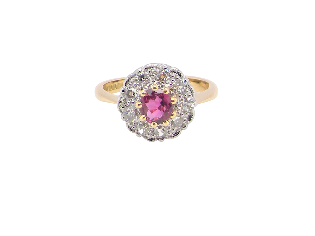 A lovely daisy cluster ring that profiles to the centre a deep red ruby, 5mm yellow claw set.
