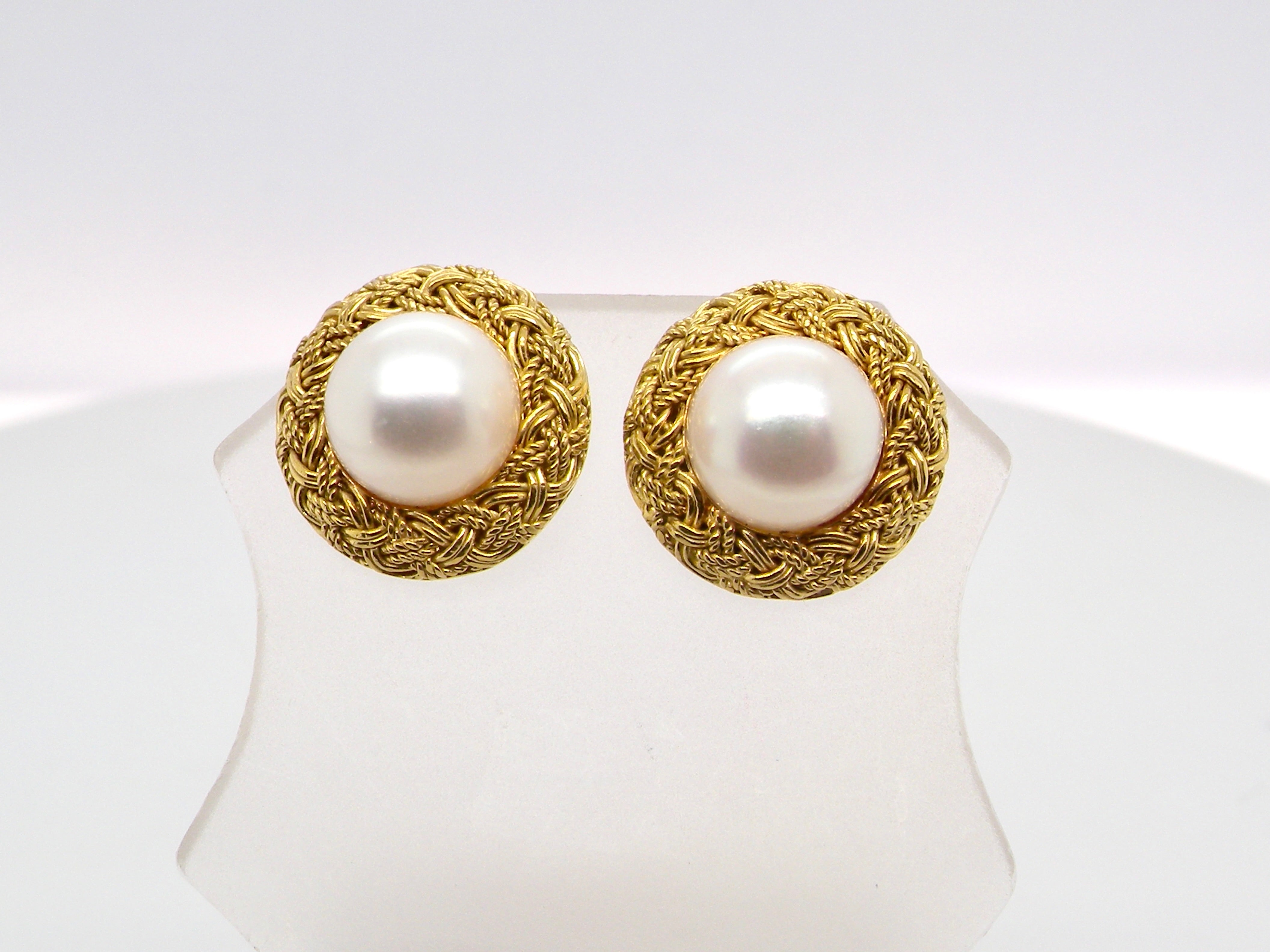 A lovely pair of elegant earrings, each set with a 7.7 mm cultured pearl.
