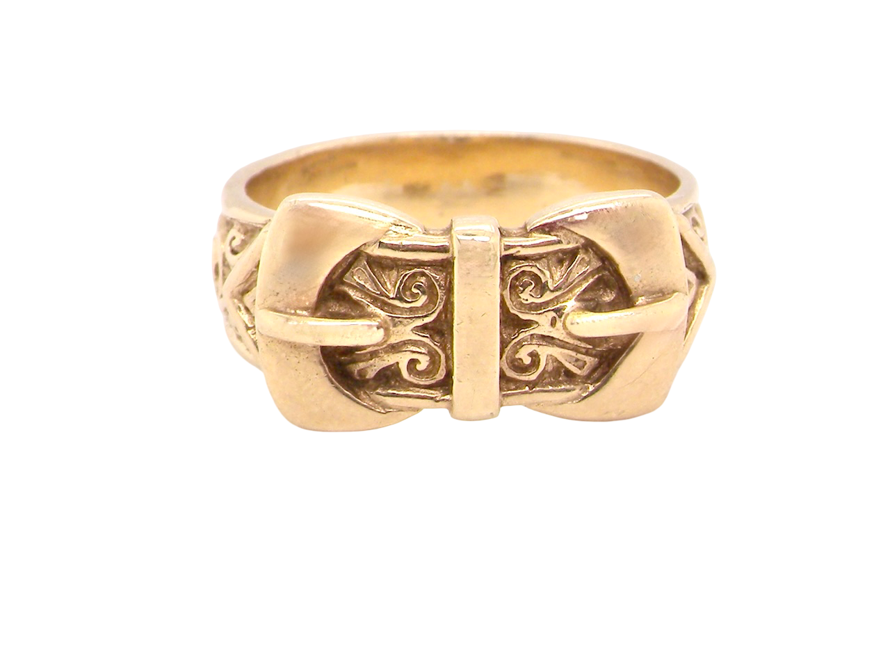 Gold ring with intricate design on a white background