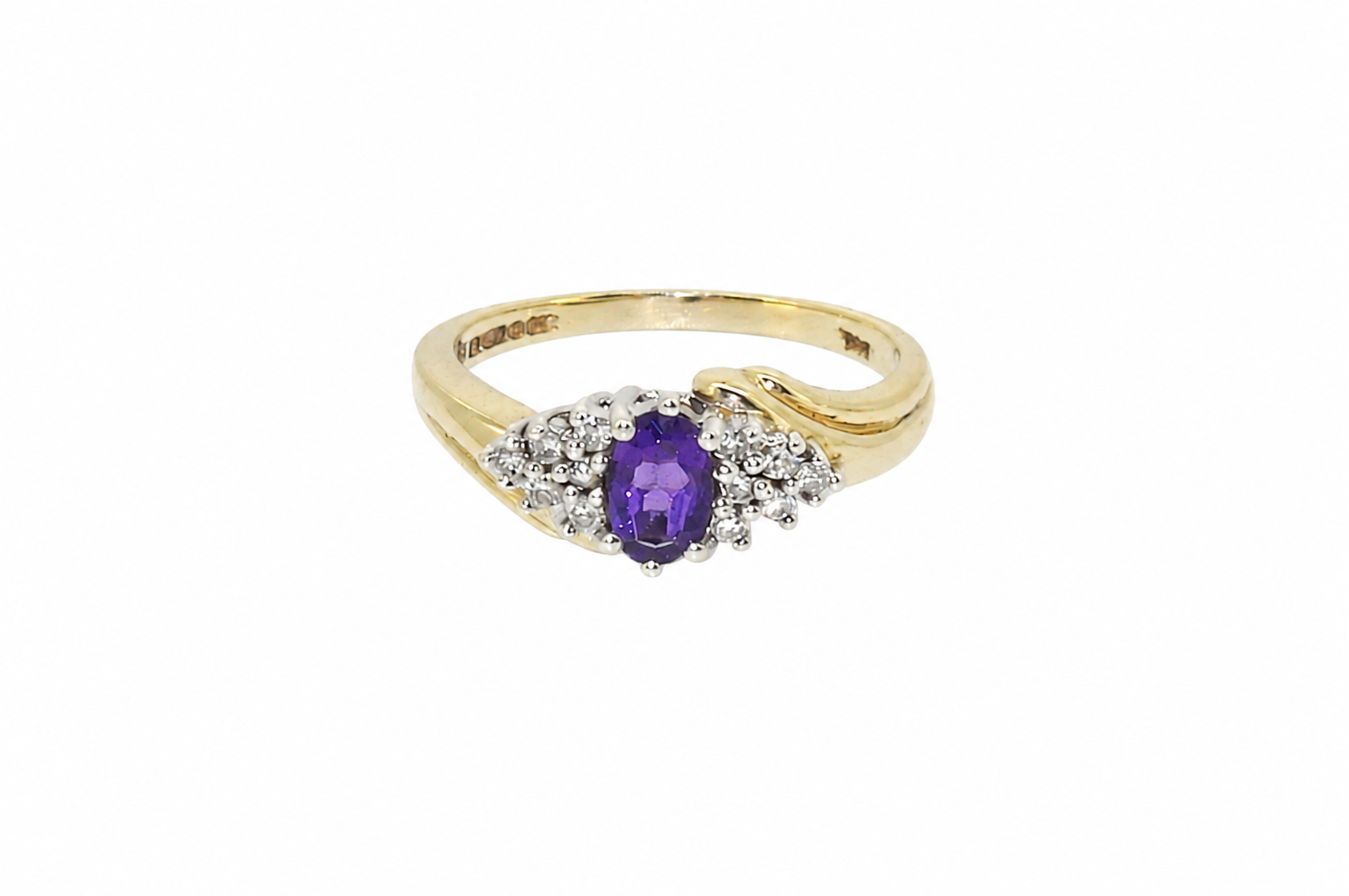 A marquise amethyst diamond cluster ring