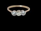 A mid to early 20th century trilogy ring set with three old brilliant cut white diamonds.

