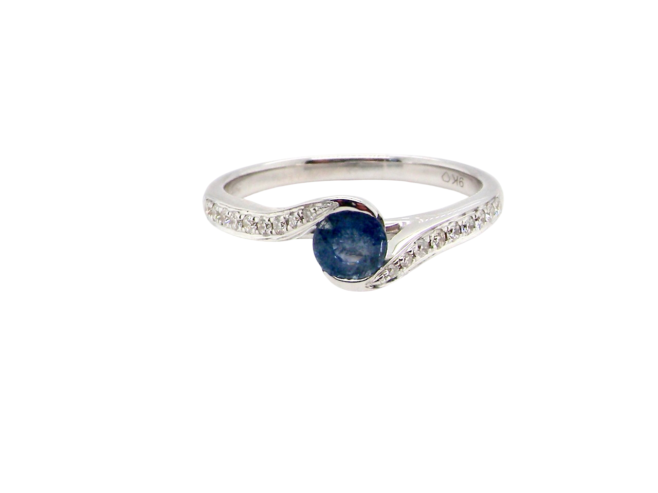 A modern Sapphire and Diamond by-pass ring