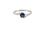A modern Sapphire and Diamond by-pass ring