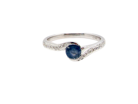 A modern Sapphire and Diamond by-pass ring