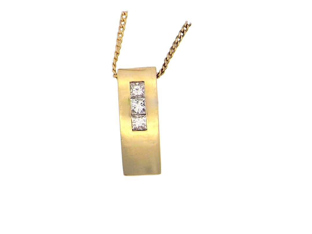 A modern block style pendant. Measures 17x6.3mm. Set with three princess cut white diamonds, close set, each measures 2.75-2.85mm 