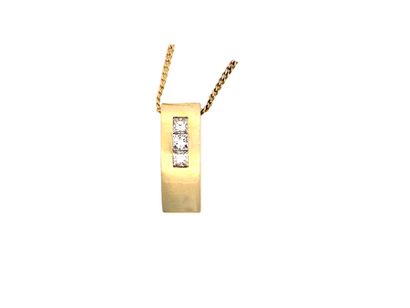 A modern block style pendant. Measures 17x6.3mm. Set with three princess cut white diamonds, close set, each measures 2.75-2.85mm (total est 0.40 carats).&nbsp;