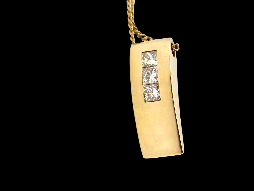 side view A modern block style pendant. Measures 17x6.3mm. Set with three princess cut white diamonds, close set, each measures 2.75-2.85mm (total est 0.40 carats).&nbsp;