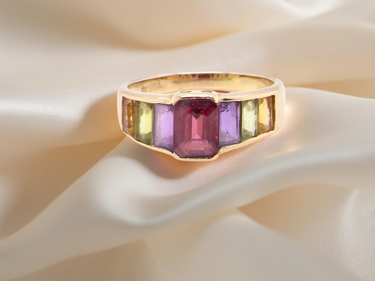 A multi gemstone dress ring