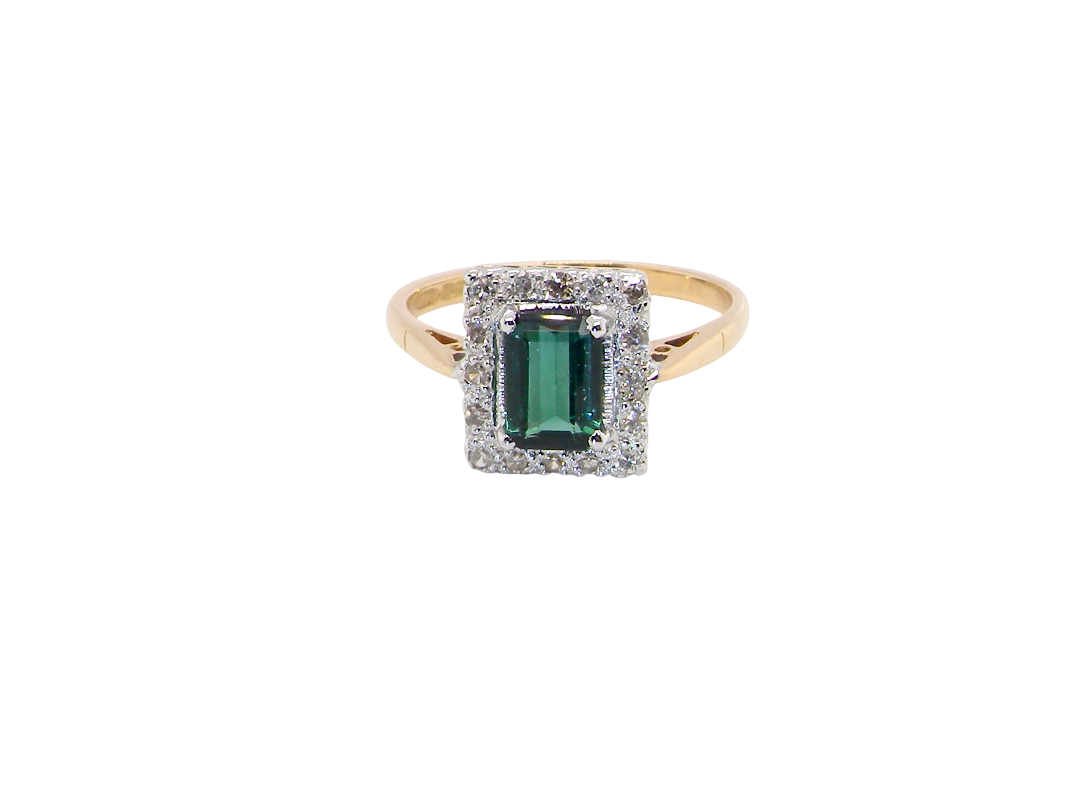 A near new cluster ring that shows no sign of wear, seems unworn.

Features a deep mint green tourmaline 