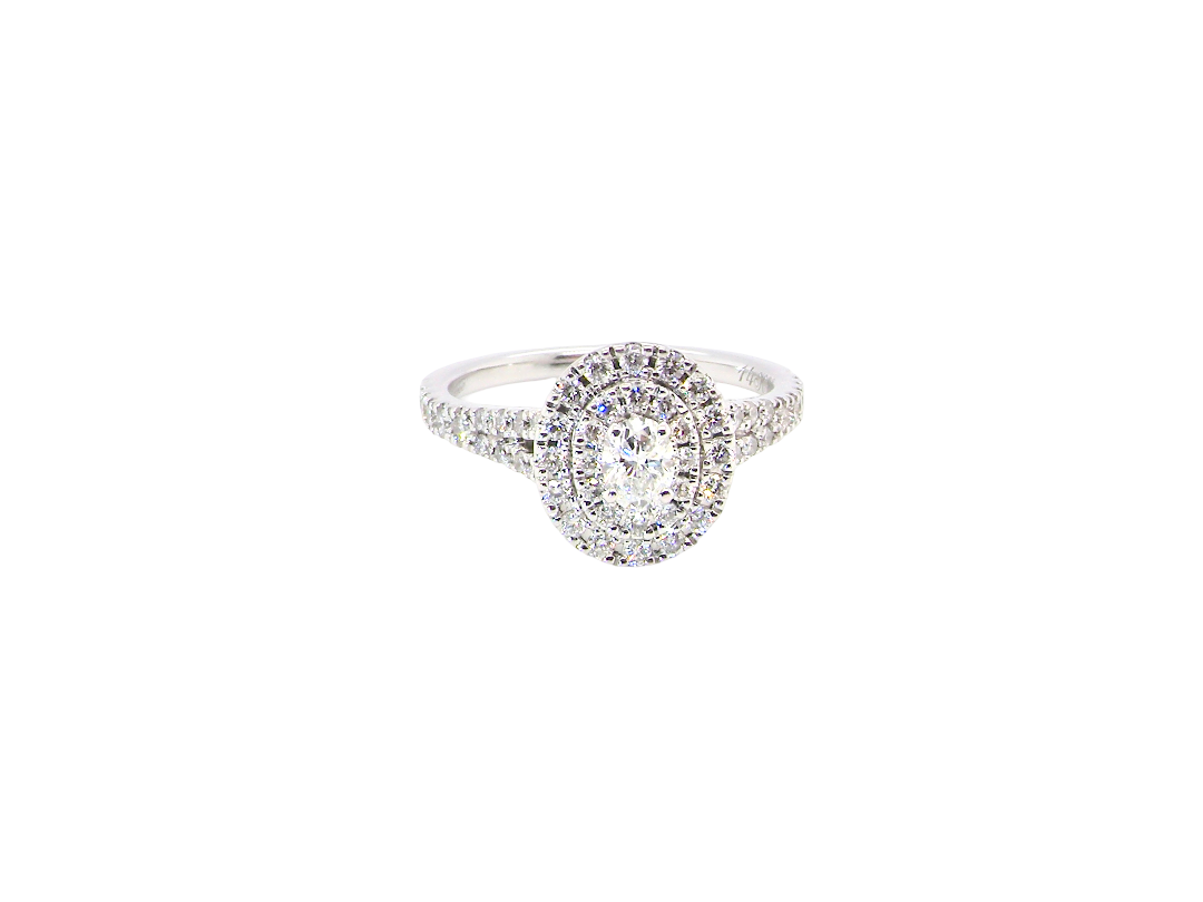 A new diamond cluster ring* An oval diamond halo cluster ring. Set with brilliant cut white diamonds, colour H-k, clarity Si.