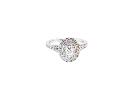 A new diamond cluster ring* An oval diamond halo cluster ring. Set with brilliant cut white diamonds, colour H-k, clarity Si.