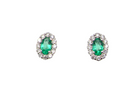 A pair of 18 carat white gold cluster earrings. The centre stone an oval cut emerald, 5x3.7mm (est 0.35 carats) deep green colour.