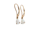 A pair of 9 carat gold drop earrings. Each set with a pear shaped white opal, 6x4mm.
