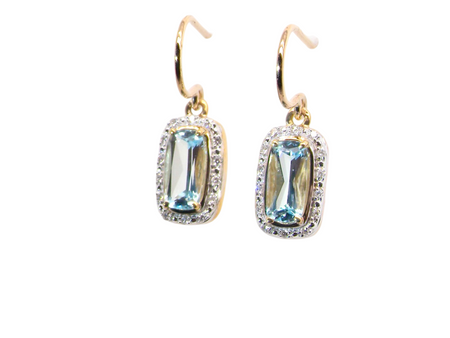 A pair of Blue Topaz and Diamond Earrings