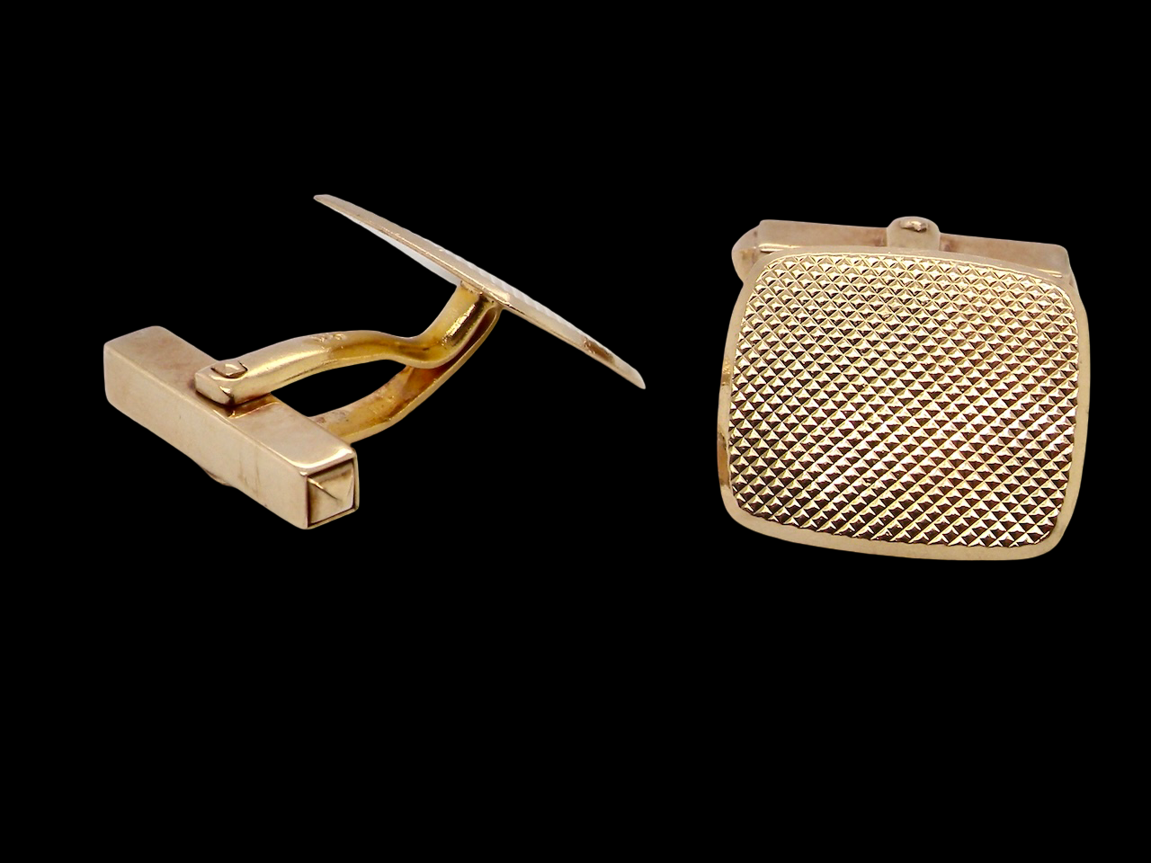 A pair of cushion shaped cufflinks. The head measures 17x15mm, 