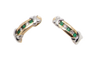 A pair of earrings, half hoop style. The centre a channel set vertical row of emeralds and diamonds, 