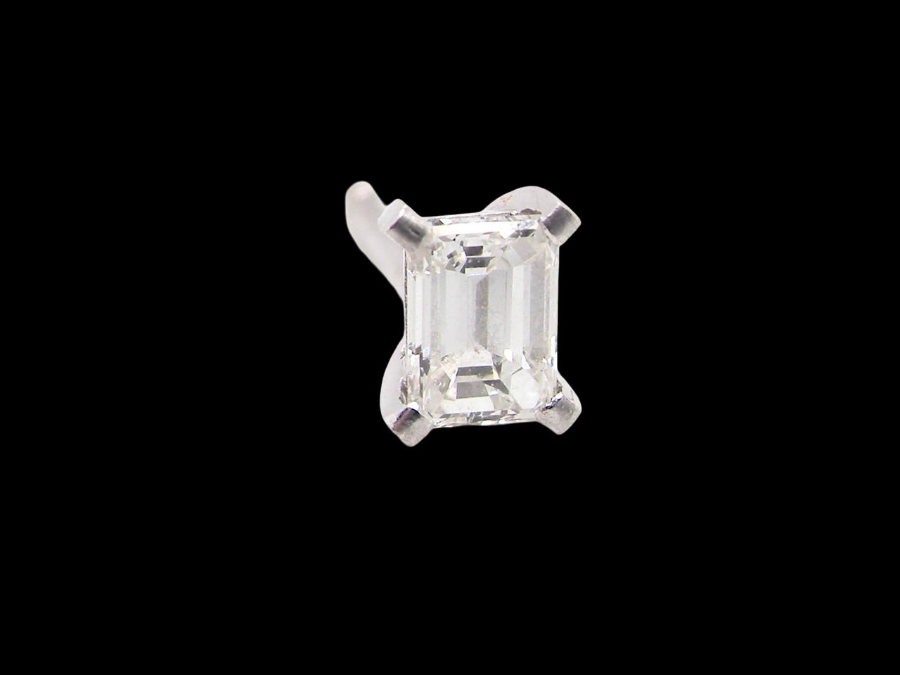 A pair of emerald cut diamond earring