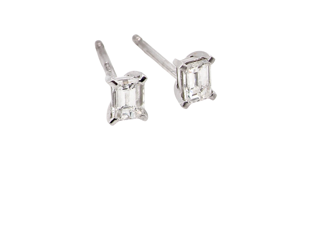 A pair of emerald cut diamond earrings