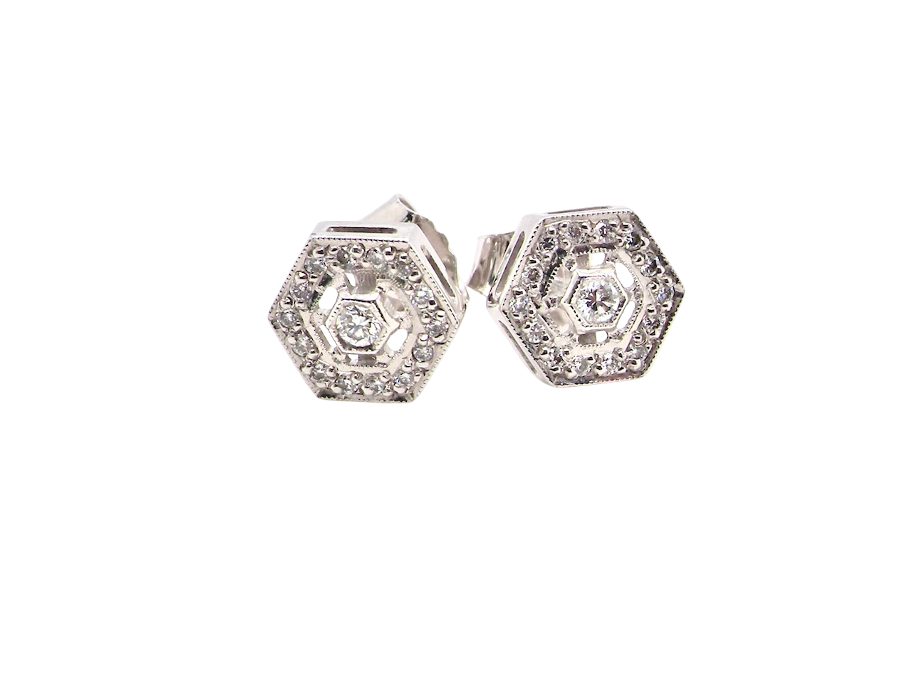 Hexagonal earrings with diamonds on a white background