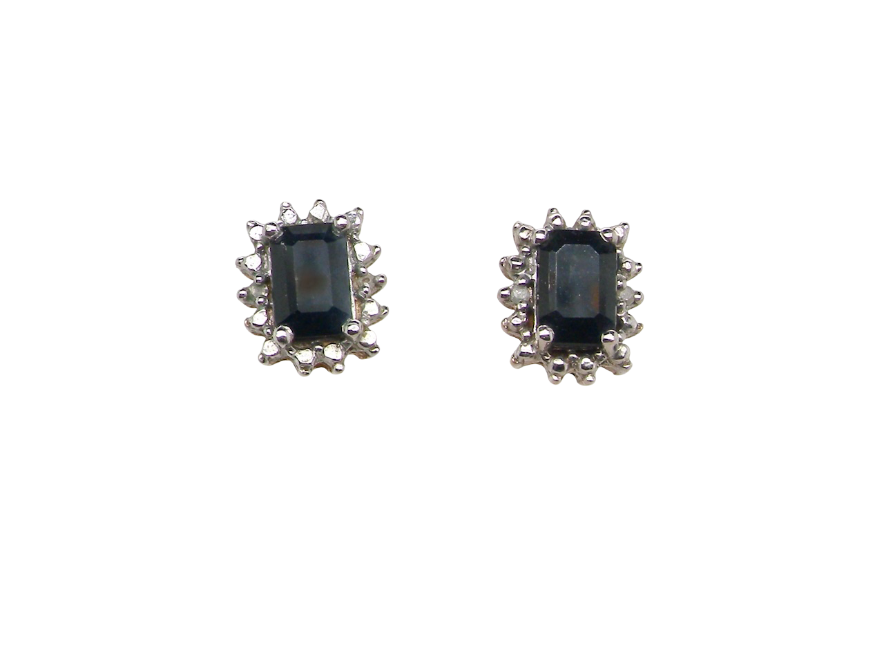 A pair of rectangular cluster earrings.

Each is set with a rectangular sapphire, ink black blue, 6x4mm. Around the edge an illusion of white dots and two small white diamonds.