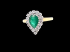 A pear shaped Emerald and Diamond cluster ring
