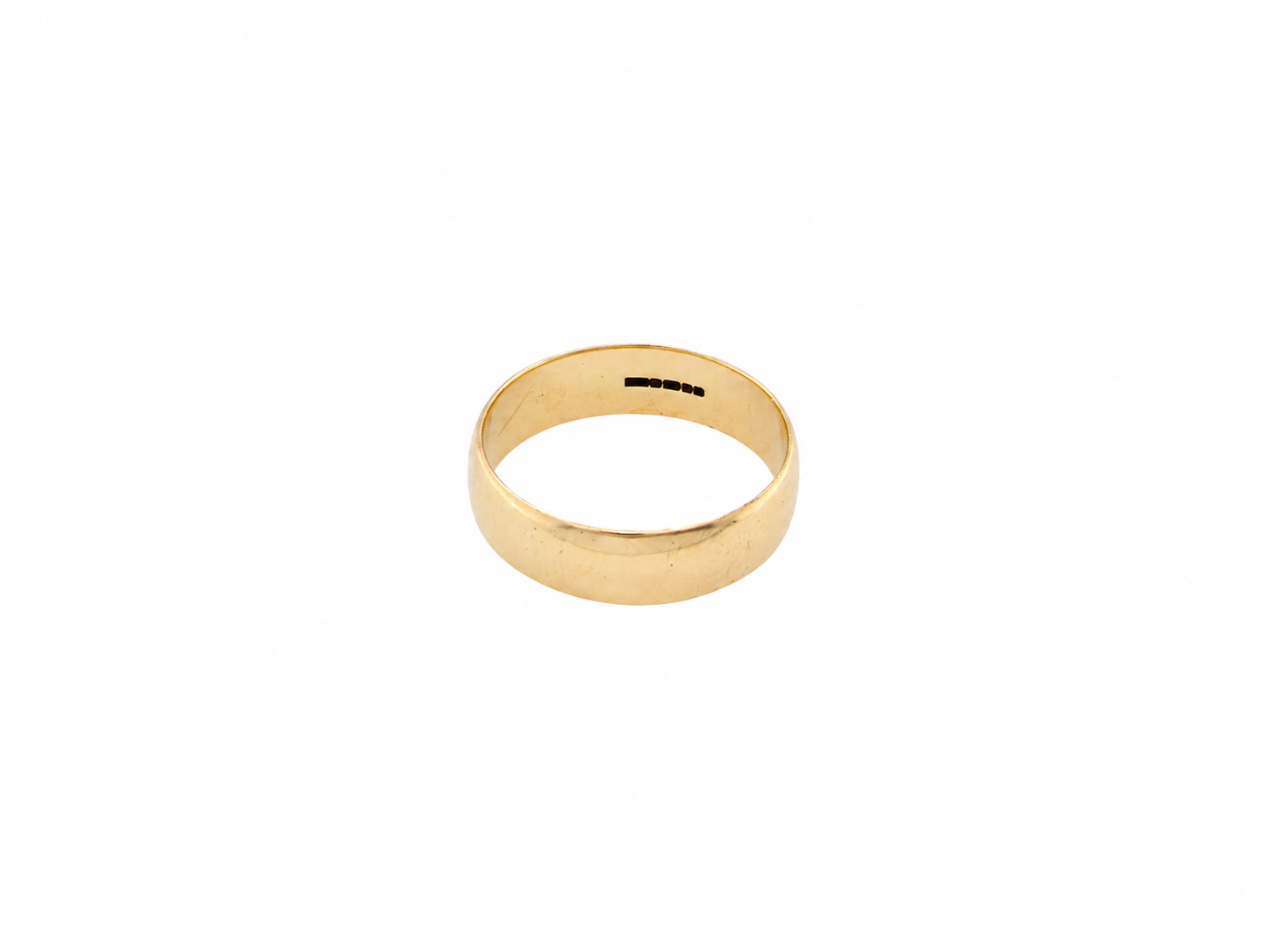 A simple gold band ring with a flat, polished surface, shown on a plain white background.