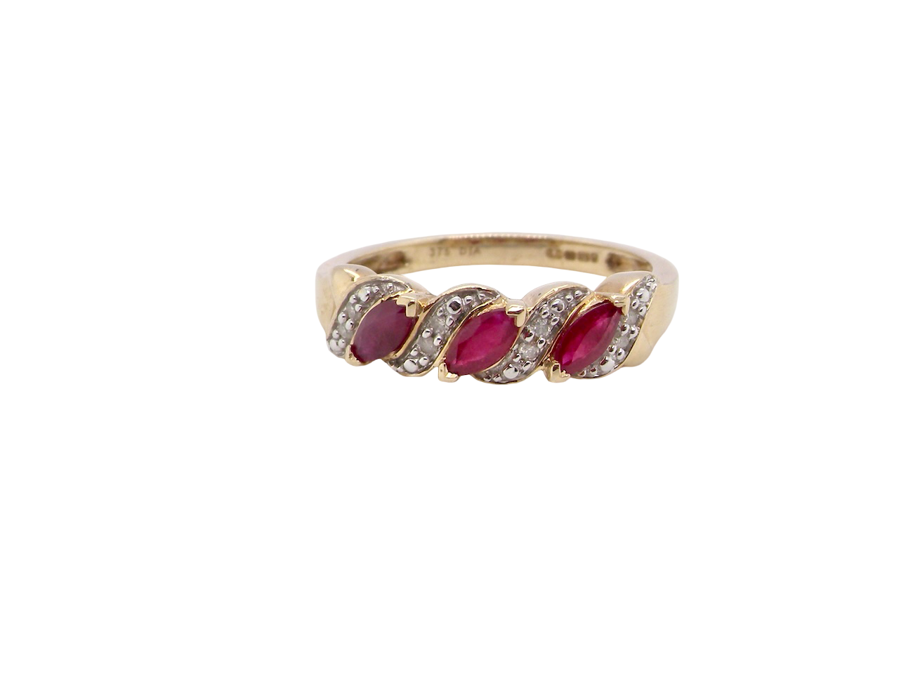 A pretty 9 carat gold dress ring. The three rubies are marquise cut, 5x3mm each, and set at an angle .