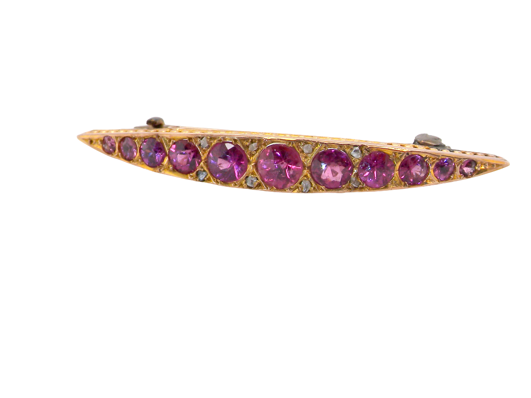 A pretty Victorian crescent shaped brooch. The principal stones are almandine garnets