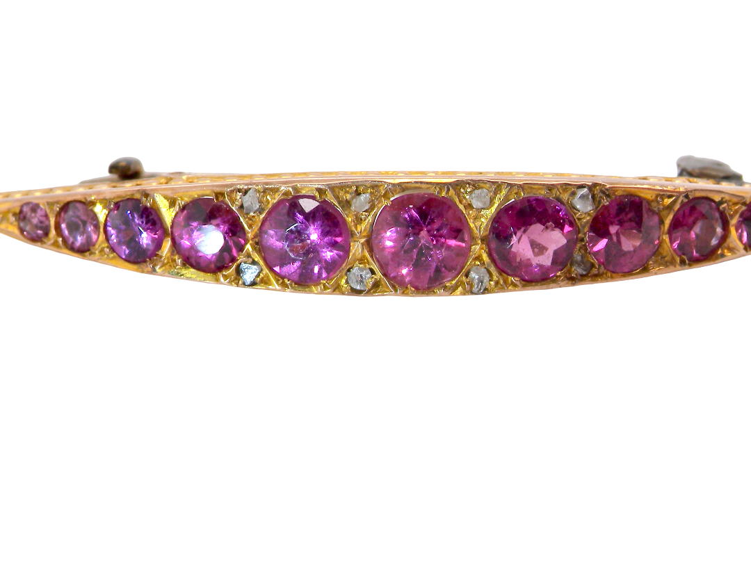A  Victorian crescent shaped brooch. The principal stones are almandine garnets