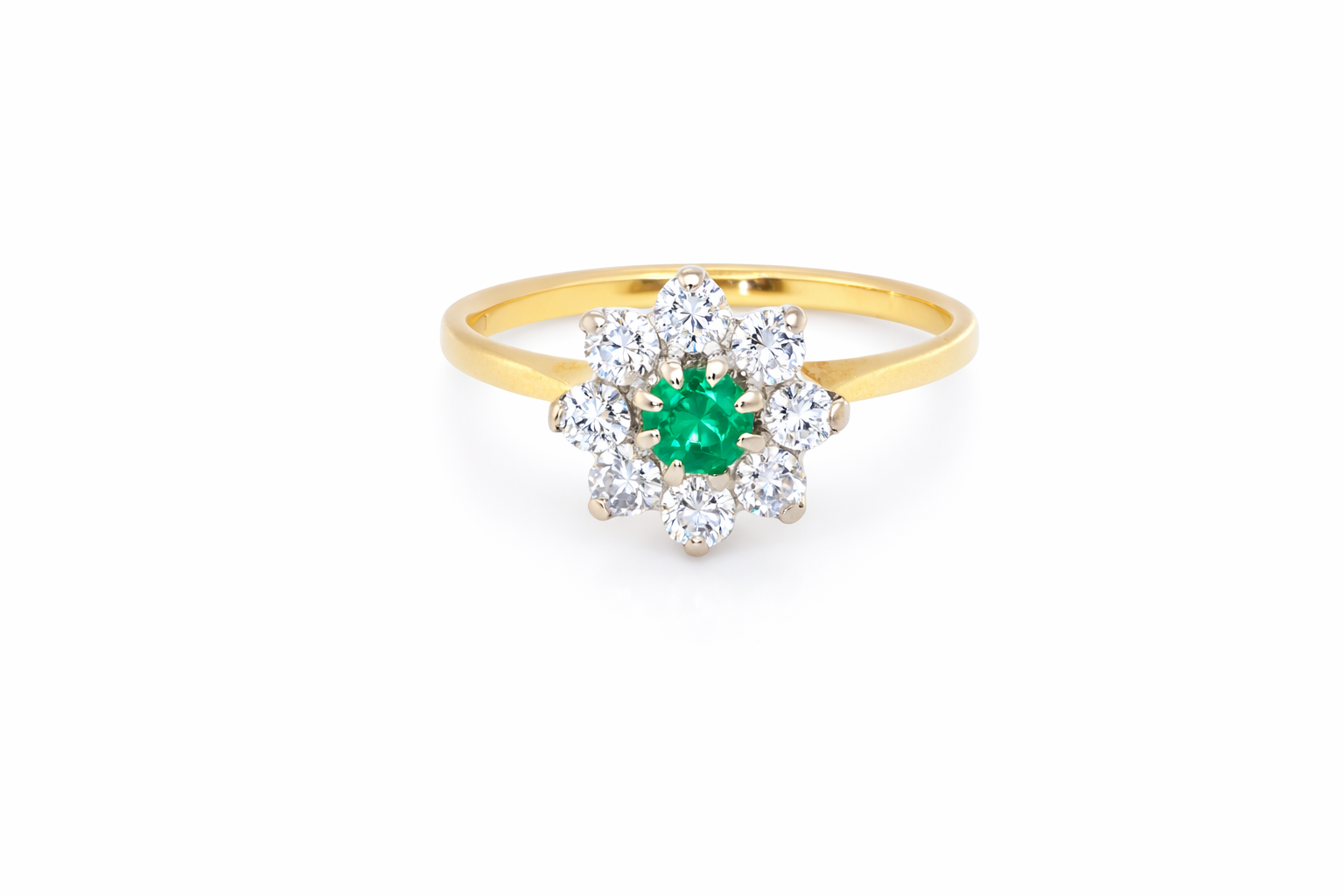 A pretty cluster ring that features a round emerald