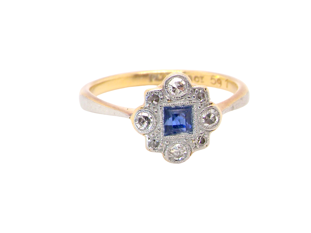 A pretty early 20th century cluster ring. The centre stone a square mid blue sapphire, 3x3mm,