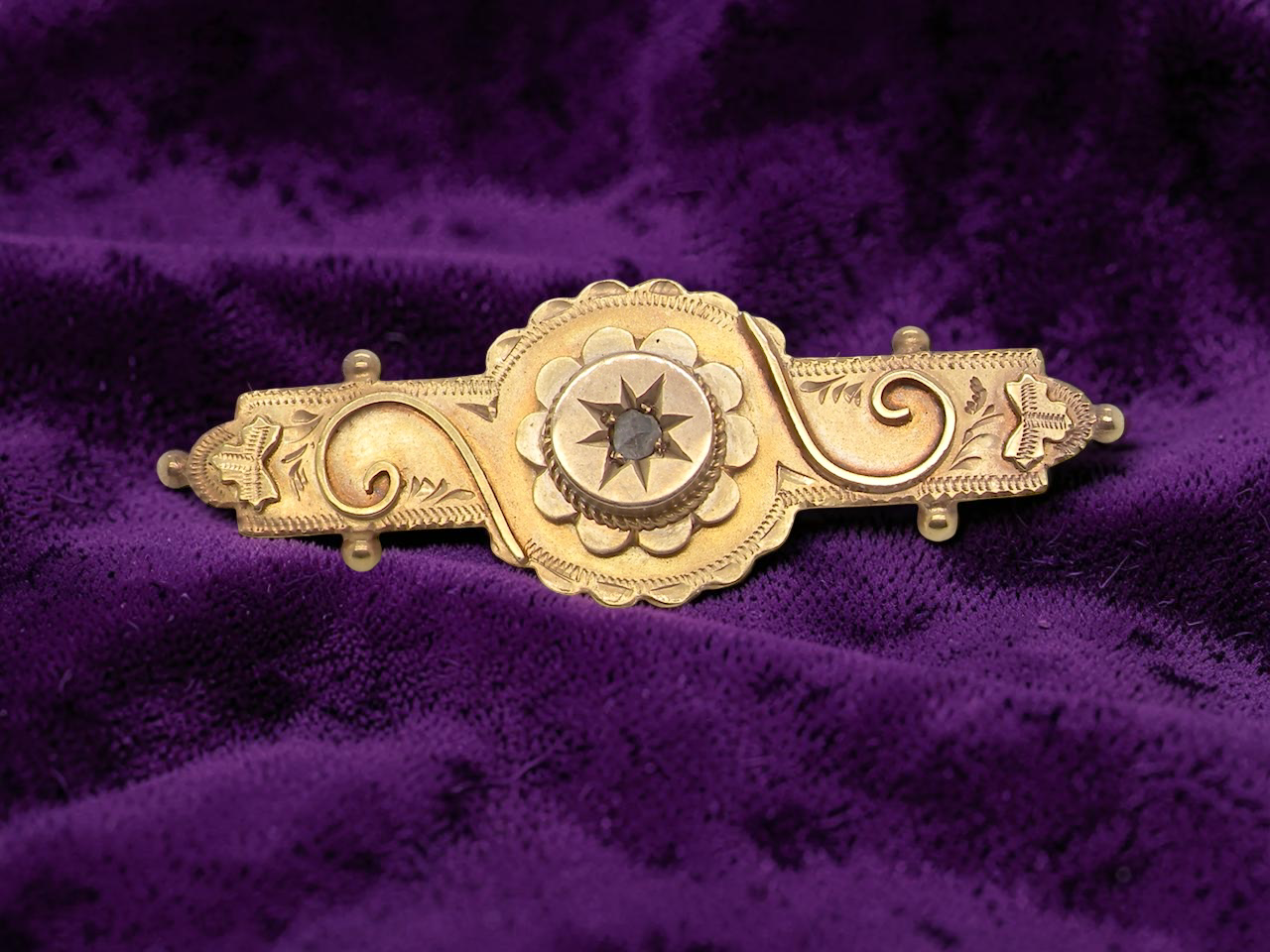 A pretty late Victorian bar brooch. Applied piqué work makes this brooch so attractive 