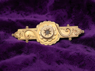 A pretty late Victorian bar brooch. Applied piqué work makes this brooch so attractive 