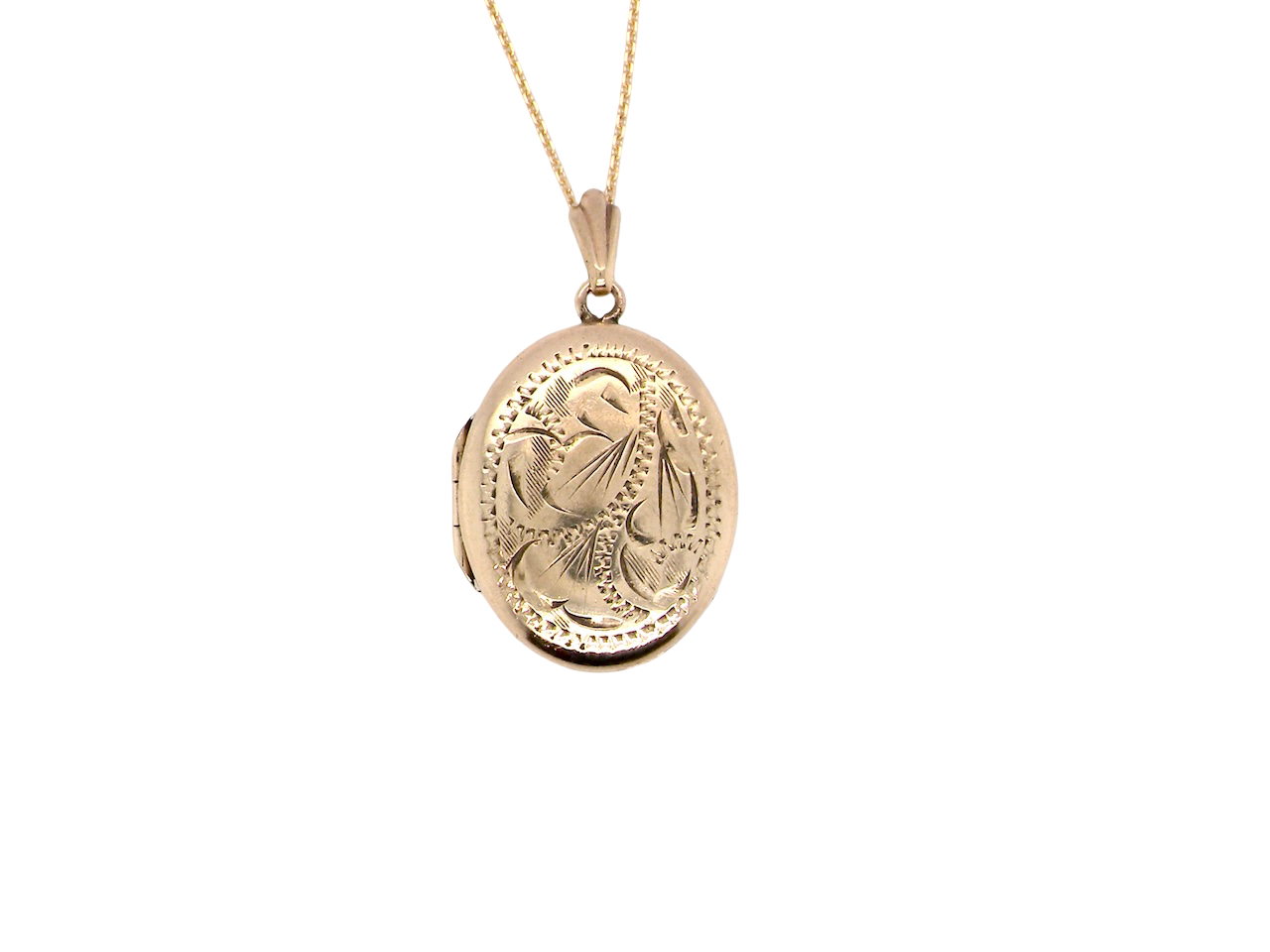 A pretty oval shaped locket. Measures 22x17mm. Hand engraved front, plain reverse

Hinges open, hallmarks for 1978.