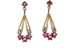 A pair of gold dangle earrings with pink gemstones and clear stones, shown against a plain white background.