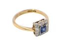 A pretty square cluster ring. Features to the centre a cornflower blue square sapphire, 4x4mm (est 0.30 carats) mille grain set.

Complimented by a halo of 1.5 mm single cut white diamonds 