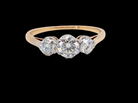A pretty three stone trilogy ring that features three brilliant cut white diamonds.

Centre diamond, 5mm (est 0.50 carats) each side a 4mm diamond (est 0.25 carats). Colour G-h, clarity Si. 