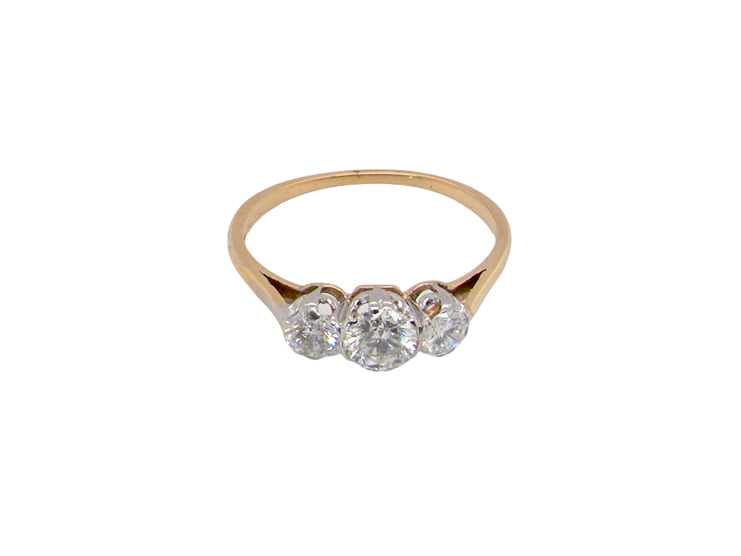 A pretty three stone trilogy ring that features three brilliant cut white diamonds.

Centre diamond, 5mm (est 0.50 carats) each side a 4mm diamond (est 0.25 carats). Colour G-h, clarity Si. Platinum rim style setting, 