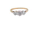 A pretty three stone trilogy ring that features three brilliant cut white diamonds.

Centre diamond, 5mm (est 0.50 carats) each side a 4mm diamond (est 0.25 carats). Colour G-h, clarity Si. Platinum rim style setting, head measures 12.7x5.3mm, depth 5.3mm, weight 2.4grams.