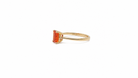 A rectangular fire opal solitaire ring side view