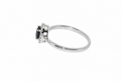 A sapphire & diamond cluster ring side view