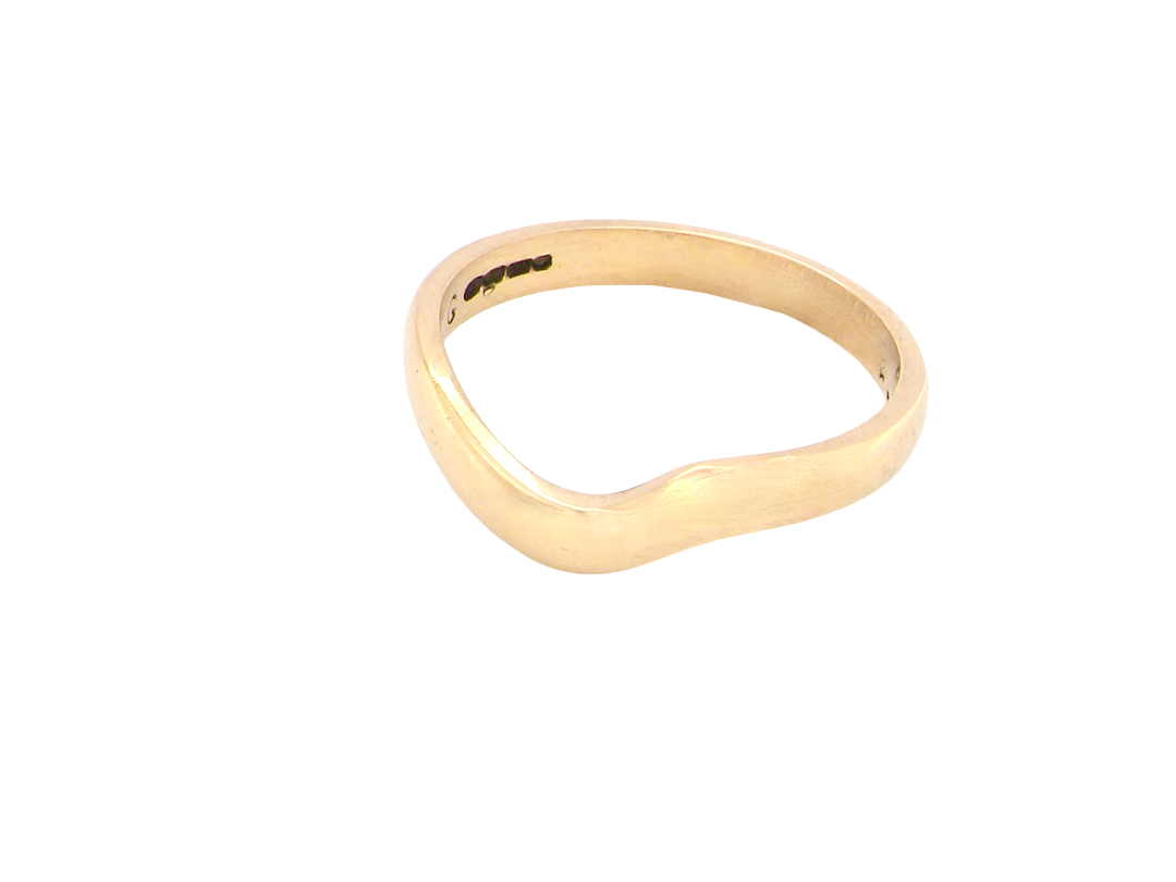 A shaped 18 carat yellow gold ring. Band width just under 3mm, weight 2.8grams.