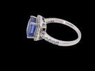 side  cluster ring featuring a 4A quality Tanzanite as its centre stone. A