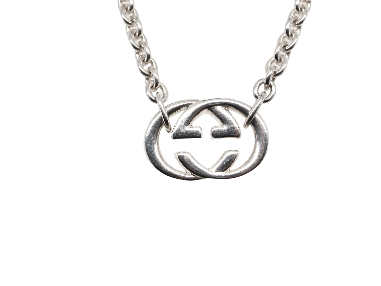 A silver Gucci GG pendant