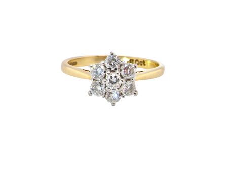 A small cluster ring set with seven bright white brilliant cut white diamonds.

Head measures 8.5mm, each diamond measures 2.8mm (total 0.50 carats