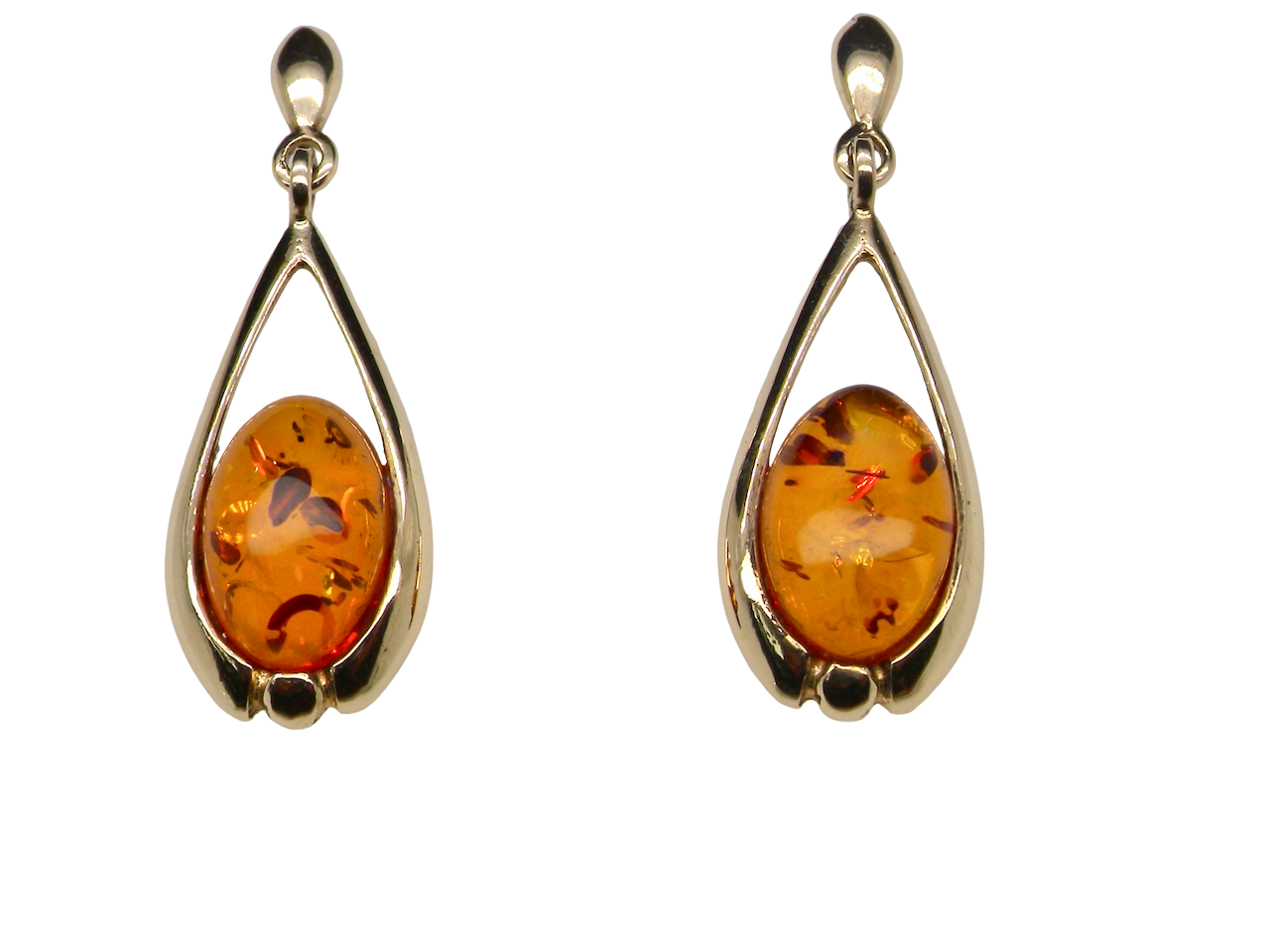 A smart pair of drop earrings, each containing an oval amber stone, 