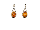 A smart pair of drop earrings, each containing an oval amber stone, measures 12x8mm.&nbsp;