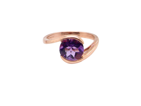 A solitaire amethyst dress ring