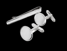 A sterling silver set. Consisting of a pair of plain oval shaped cufflinks. Head 17x13mm, torpedo fittings. Hallmarks for 1994.